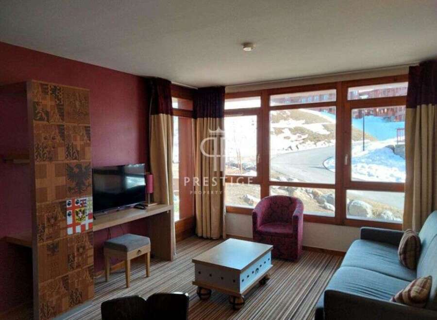 Discover a cozy living space with a stunning view.
