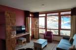 Discover a cozy living space with a stunning view.