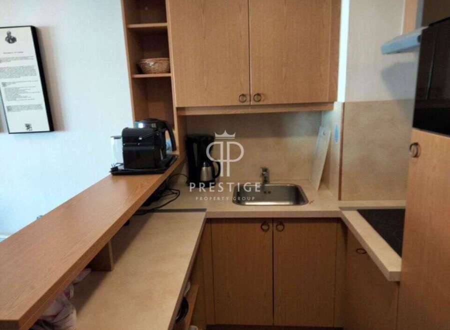 Discover a compact yet functional kitchen space, perfect for efficient living.