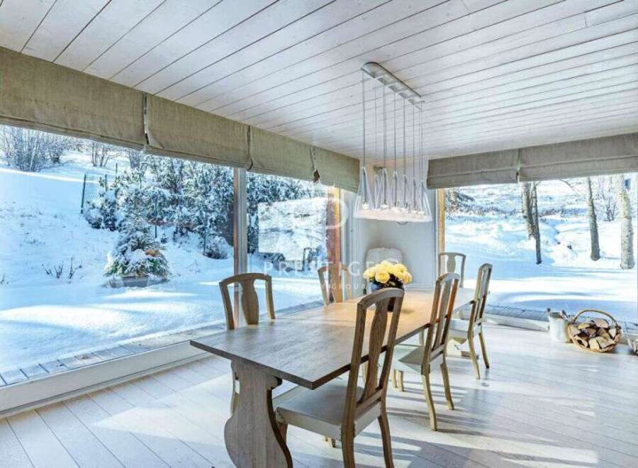Experience the serene beauty of winter from this stunning dining room.