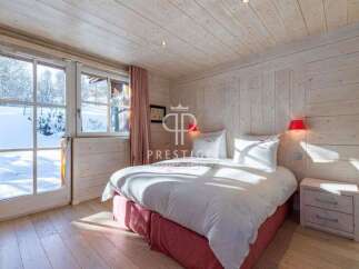 Experience the charm of this cozy bedroom, featuring a stunning wooden interior that exudes warmth and comfort.