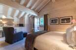 Experience the epitome of rustic elegance in this stunning bedroom.