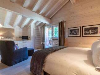 Experience the epitome of rustic elegance in this stunning bedroom.