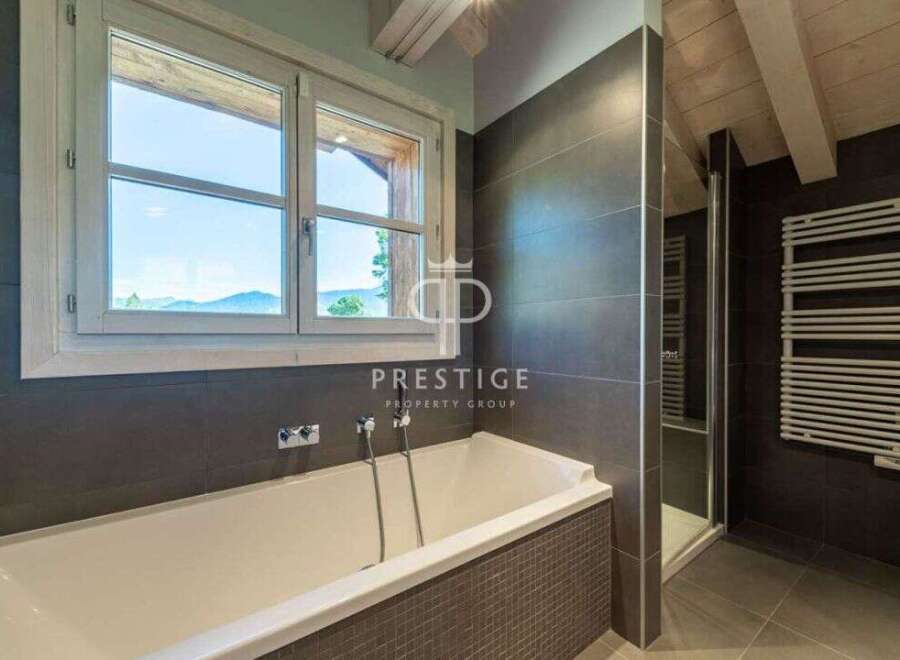 Discover luxury living in this stunning property! Enjoy breathtaking views from the large windows, perfect for relaxation.