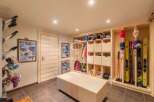 Discover the ultimate ski storage solution in this stunning property! Featuring custom-built wooden shelving and storage, this space is designed to keep your gear organized and accessible.