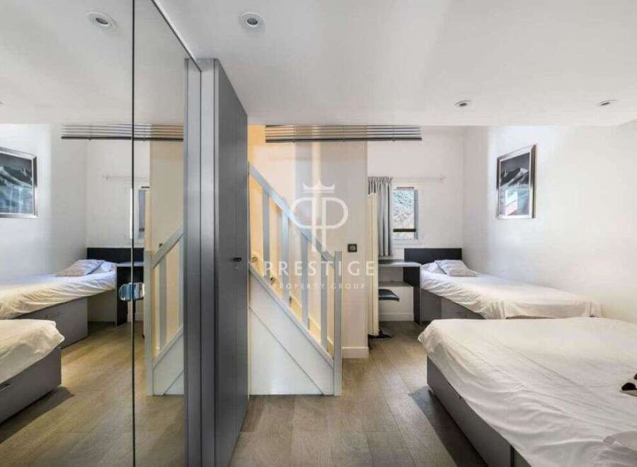 Discover a modern and stylish property featuring multiple single beds, perfect for shared living or a guest room setup.
