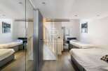 Discover a modern and stylish property featuring multiple single beds, perfect for shared living or a guest room setup.