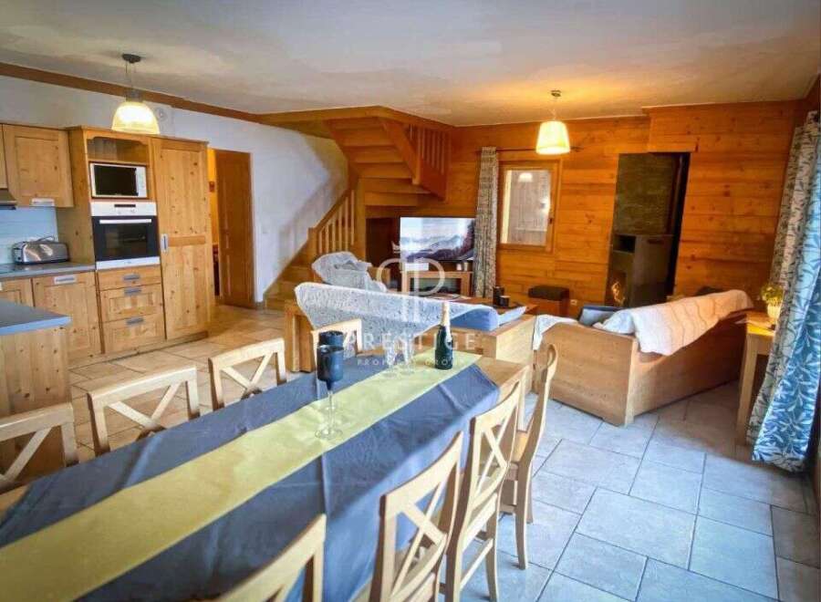 Discover the charm of this cozy property, featuring a warm wooden interior and a welcoming atmosphere.