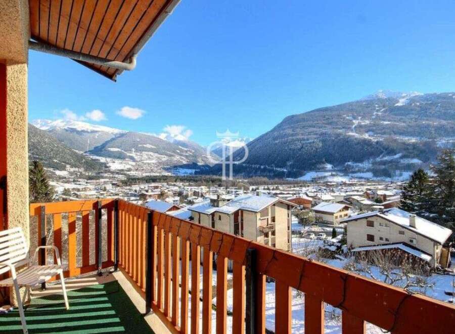 Enjoy breathtaking mountain views from this charming balcony.