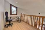 Discover a charming loft space with a stunning mountain view.