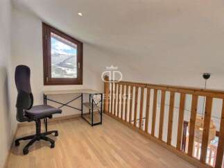 Discover a charming loft space with a stunning mountain view.