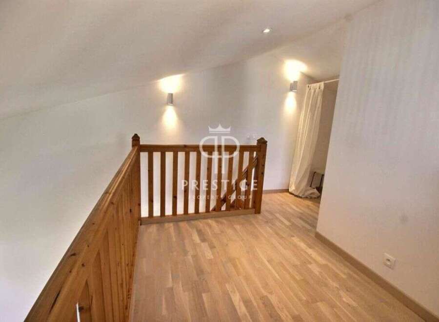 Discover this stunning property featuring a beautifully designed wooden staircase and flooring, creating a warm and inviting atmosphere.