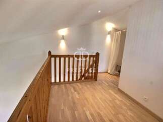 Discover this stunning property featuring a beautifully designed wooden staircase and flooring, creating a warm and inviting atmosphere.