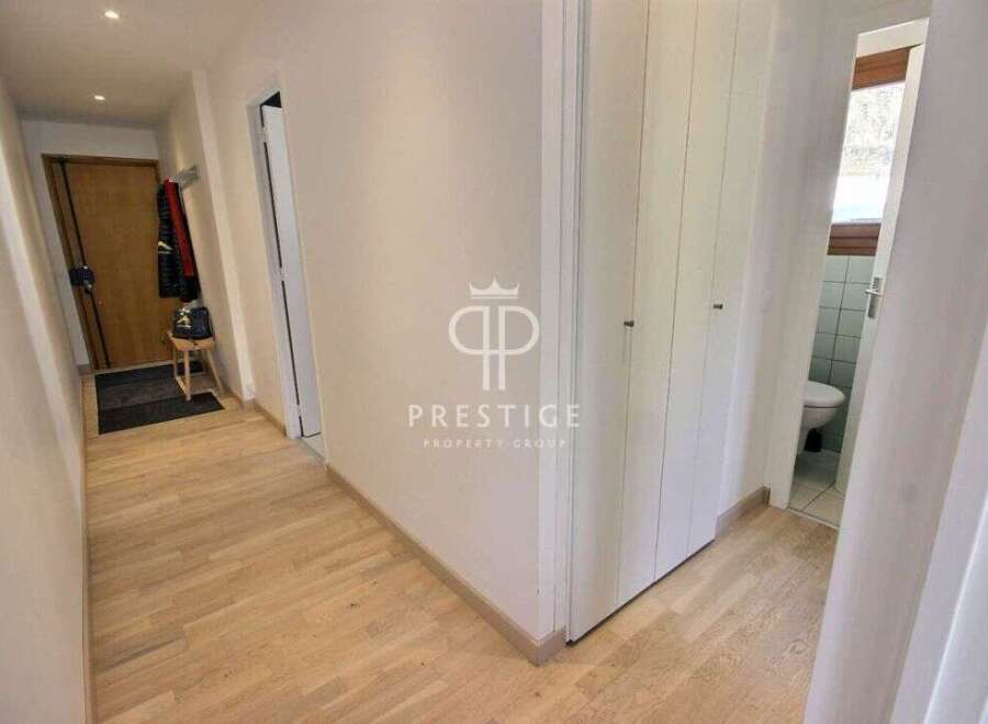 Discover this stunning property featuring a bright and airy hallway with beautiful wooden floors.