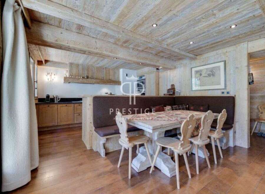 Experience rustic charm in this stunning property, featuring a beautifully designed dining area with wooden accents.