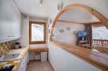Discover a charming ski chalet with stunning mountain views.