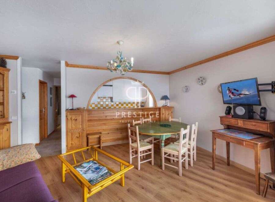 Discover a cozy living space with a charming dining area.