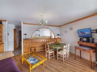 Discover a cozy living space with a charming dining area.