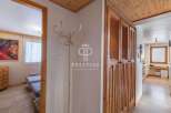 Discover the charm of this property, featuring elegant wooden cabinetry and a welcoming hallway.