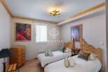 Discover a cozy bedroom with two twin beds, perfect for guests or family.