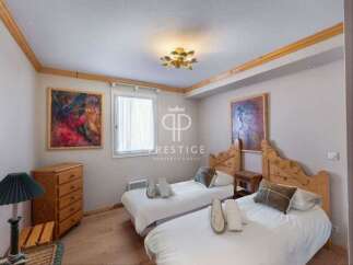 Discover a cozy bedroom with two twin beds, perfect for guests or family.