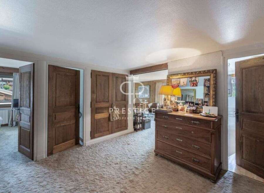 Discover the charm of this property, featuring elegant wooden doors and a cozy, inviting atmosphere.