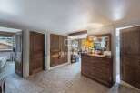Discover the charm of this property, featuring elegant wooden doors and a cozy, inviting atmosphere.