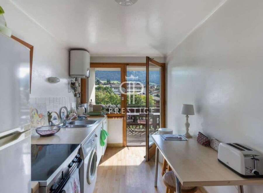 Discover a charming kitchen with a bright and airy feel, perfect for preparing delicious meals.
