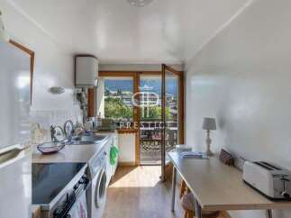 Discover a charming kitchen with a bright and airy feel, perfect for preparing delicious meals.
