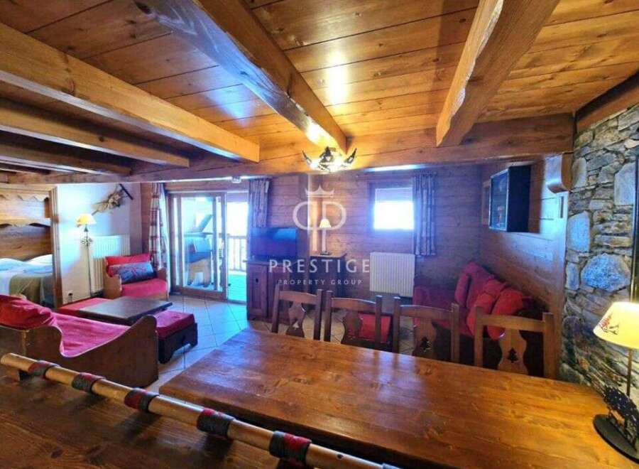 Discover the charm of this cozy property, featuring a rustic wooden interior and a warm, inviting atmosphere.