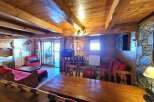 Discover the charm of this cozy property, featuring a rustic wooden interior and a warm, inviting atmosphere.