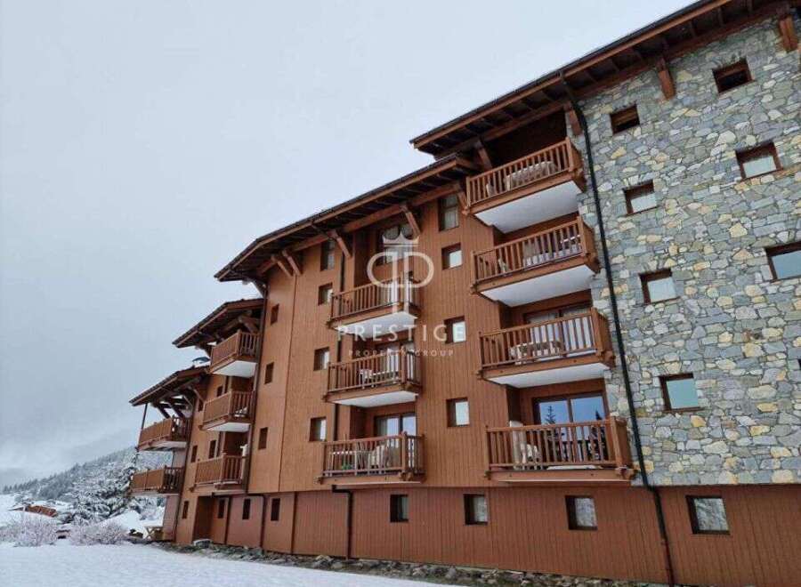 Discover the charm of this stunning property, featuring a beautiful wooden facade and inviting balconies.