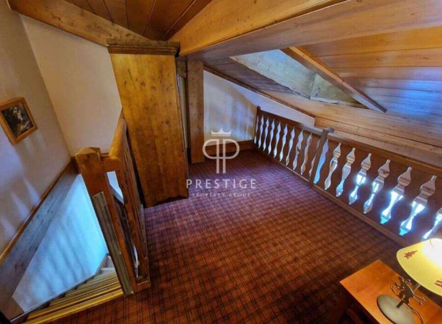 Discover the charm of this property, featuring a cozy interior with wooden accents and a unique architectural design.