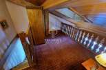 Discover the charm of this property, featuring a cozy interior with wooden accents and a unique architectural design.