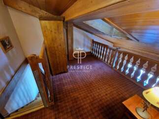 Discover the charm of this property, featuring a cozy interior with wooden accents and a unique architectural design.
