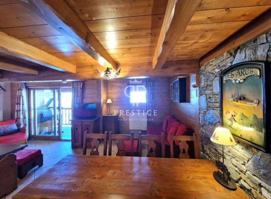 Discover the charm of this cozy property, featuring a rustic wooden interior and a warm, inviting atmosphere.