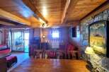 Discover the charm of this cozy property, featuring a rustic wooden interior and a warm, inviting atmosphere.