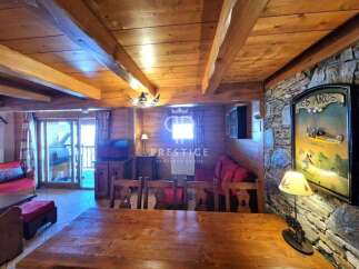 Discover the charm of this cozy property, featuring a rustic wooden interior and a warm, inviting atmosphere.