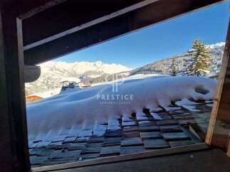 Experience breathtaking mountain views from this stunning property.