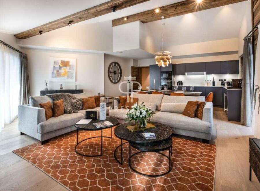 Experience luxury living in this stunning property, featuring a spacious living area with a modern kitchen.