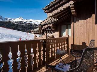 Enjoy breathtaking mountain views from this luxurious chalet.