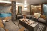 Luxurious chalet featuring a stunning indoor pool and spa area.