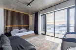 Experience luxury in this stunning bedroom with breathtaking mountain views.