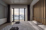 Experience breathtaking mountain views from this luxurious bedroom.