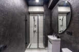 Modern bathroom design featuring a sleek shower enclosure and a stylish vanity.