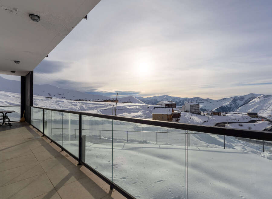 Enjoy breathtaking mountain views from this stunning balcony.
