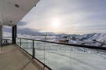 Enjoy breathtaking mountain views from this stunning balcony.