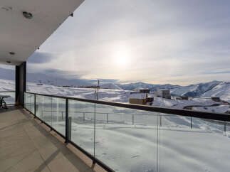 Enjoy breathtaking mountain views from this stunning balcony.