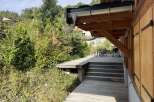 This stunning property boasts a spacious deck perfect for outdoor entertaining, complete with a built-in grill and ample seating.