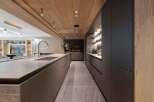 Experience luxury living in this stunning kitchen, featuring a sleek design and high-end finishes.
